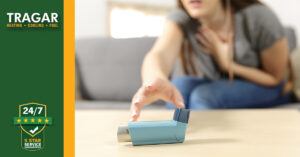 Woman reaching for asthma rescue inhaler.