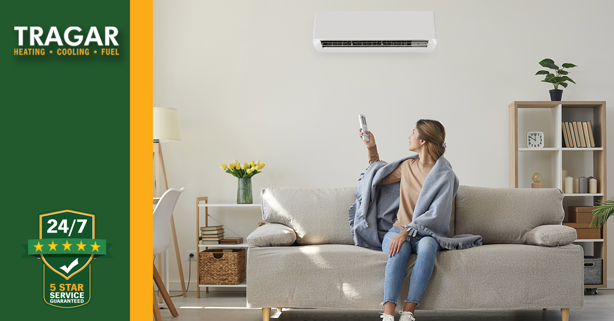 Woman changing AC temperature