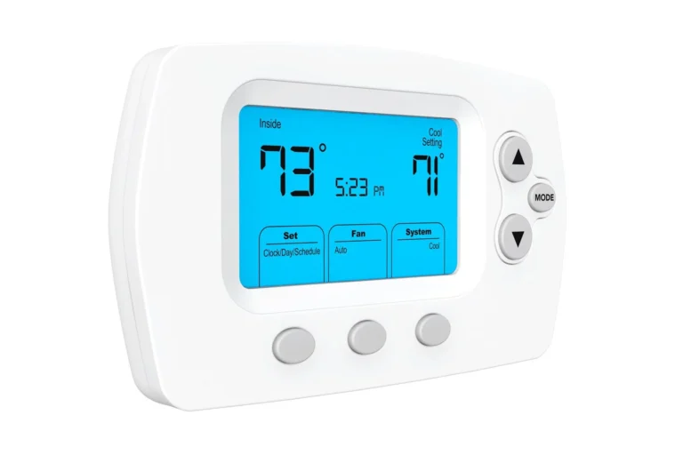 A digital thermostat displaying 73°F inside and a cool setting of 71°F, with the time shown as 5:23 PM.