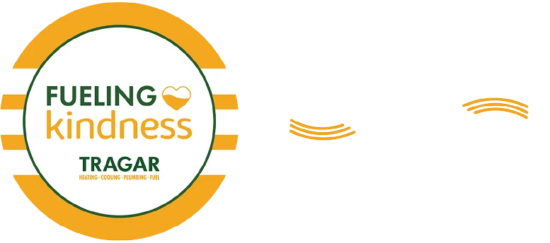 A circular logo reads "Fueling Kindness Tragar" with a heart symbol, next to the words "Spread the warmth!" in bold white text with orange accent lines.