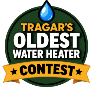 Circular badge reading “Tragar’s Oldest Water Heater Contest,” with a blue water droplet on top and a gold banner labeled “Contest” at the bottom.